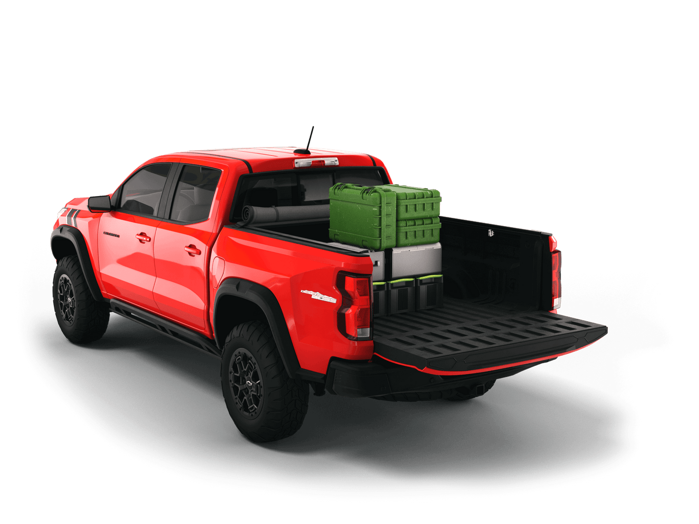 Red Chevrolet Colorado / GMC Canyon with gear in the truck bed and the Sawtooth Stretch tonneau cover rolled up at cab